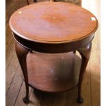 A 19th century-style circular mahogany occasional table with under tier, raised on cabriole legs,