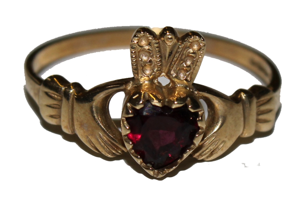 A 9 carat gold ring of two hands holding a heart shaped garnet