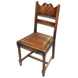 A set of six early 20th century oak stained dining chairs with carved top rails, leather upholstered