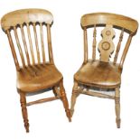 Two 19th century elm seated kitchen chairs with shaped top rails, spindle supports, raised on turned