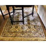 An ivory ground Kashmir-style drawing room rug with multicoloured floral and foliate depictions,