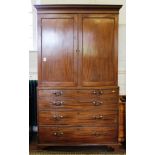 A Georgian mahogany linen press with moulded cornice, twin panelled door, the interior fitted for