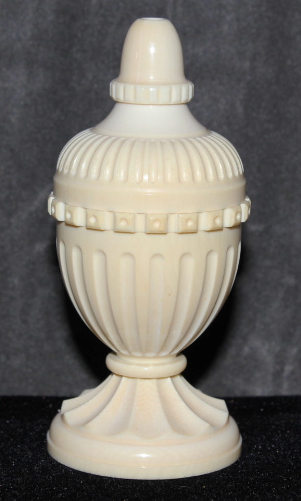 A small ivory urn shaped salt seller, 10cm high The Art Deco Carvings of W. G. Collins (1872-1959)