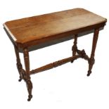 A late Victorian oak oblong centre or occasional table with moulded top, raised on circular turned