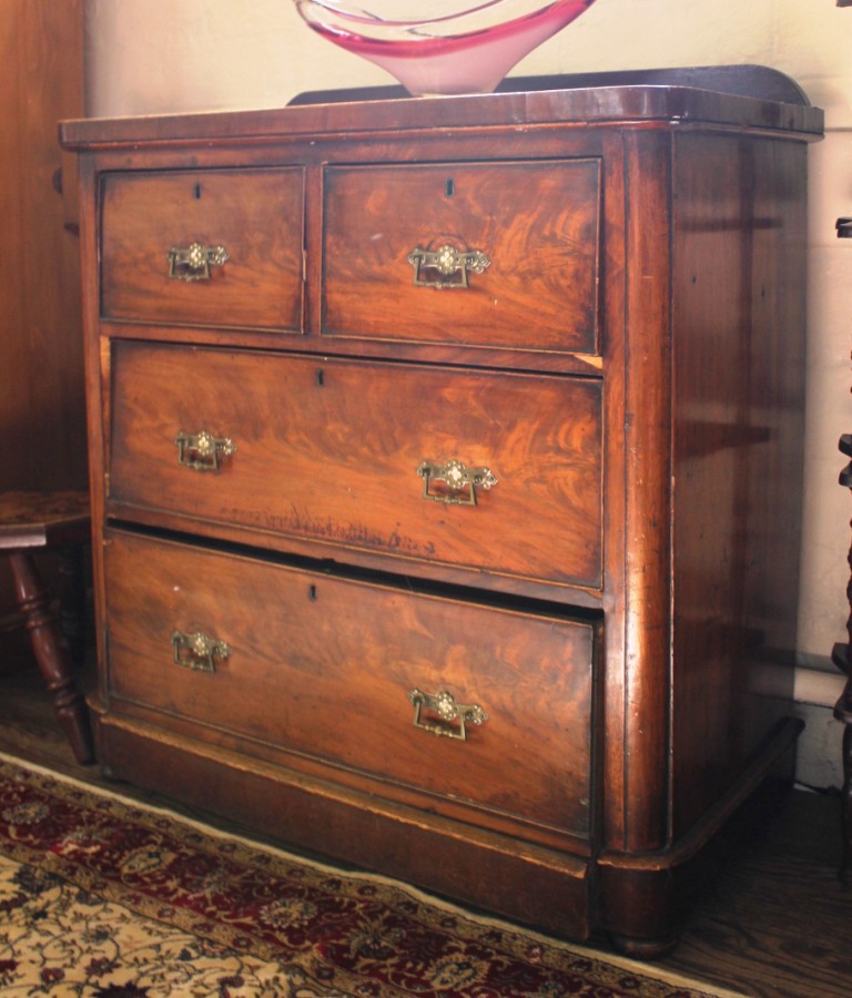 A Victorian mahogany chest of two small and two long graduating drawers with moulded top, cock