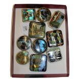 A collection of lady's powder compacts