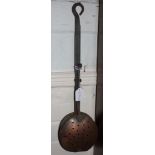 A 19th century circular copper chestnut roaster with long metal handle