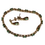 A lady's diamond and emerald bracelet with matching earrings set in 9 carat gold
