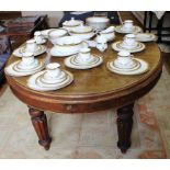 A George IV mahogany oval shaped extending 'D' end dining table with shaped top, one extra leaf,