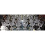 A set of eighteen cut crystal red wine glasses with faceted design, 12.5cm high