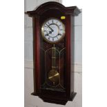 A Canterbury 31 day Victorian-style mahogany wall clock with Roman numerals on a circular dial