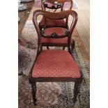 A set of six Victorian mahogany dining room chairs with shaped top rails, carved support, fabric