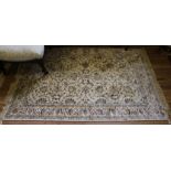 An ivory-ground Kashmir-style drawing room rug with multicoloured floral and foliate depictions,