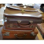 A selection of early 20th century briefcases and attaches