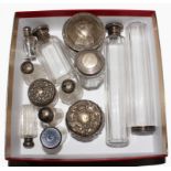A collection of thirteen silver and plated top toilet bottles