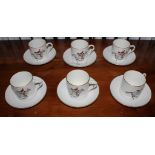 A set of six Royal Worcester coffee cups and saucers with equine theme and gold rims