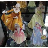 Four Royal Doulton figurines of ladies