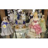 An assortment of eight Royal Doulton, Coalport and Franklin Mint figurines of ladies, to include a