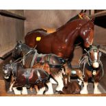 A broad assortment of ceramic figurines of horses, to include a Clydesdale and foals