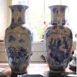 A pair of Oriental-style baluster shaped blue on white flower vases with floral, foliate and avian