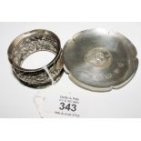 A silver napkin ring and a small silver dish (2)