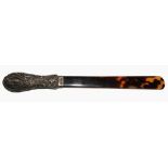 A silver handled tortoise shell page turner