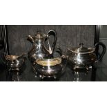 A Victorian four piece tea service comprising tea pot, hot water jug, sugar bowl and cream jug