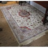 A Kashmir-style ivory-ground multicoloured floor rug with double border, central medallion with