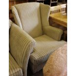 A contemporary fabric upholstered wood-framed wingback armchair with removable cushion, 82cm wide