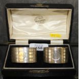 A pair of boxed silver napkin rings, 46g