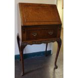 A smaller sized Georgian walnut veneered bureau with fold down lid, fitted interior, one drawer