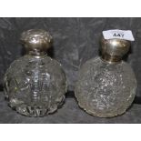 Two-silver topped round scent bottles