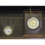 A late 19th century Continental-style mahogany framed mantle clock with brass handle and ormolu