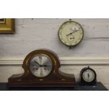 An Edwardian mahogany cased dome topped mantle clock with cross banding and mother of pearl inlay to