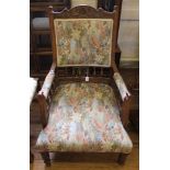 An Arts and Crafts mahogany framed armchair with carved top rail, fluted supports, William Morris-