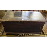 A 19th century stained pine blanket box of oblong form, lift up lid, metal drop handles to the