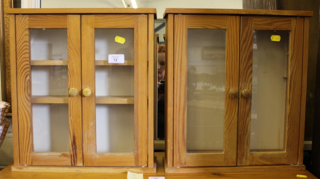 A pair of smaller red deal wall cabinets with shaped top, glazed doors, shelves interiors, each 47cm