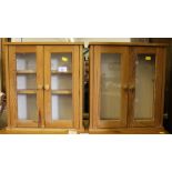 A pair of smaller red deal wall cabinets with shaped top, glazed doors, shelves interiors, each 47cm