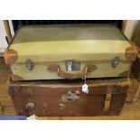 Two early 20th century travelling trunks with leather and metal adornments