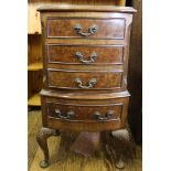 A Georgian-style mahogany and walnut bow fronted smaller chest of drawers or bedside locker with