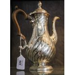 A George III silver coffee pot, having half fluted decoration on round foot, London 1772, possibly