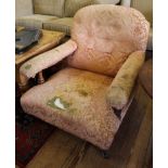 A Victorian mahogany-framed low armchair with button back fabric upholstered support, arms and