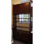 A Ladderax shelving unit comprising drinks cabinet and sliding cupboards with adjustable shelves, (