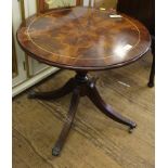 A Georgian-style mahogany circular occasional table with string inlay to top on a quadruped base,