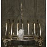 Victorian six division silver toast rack on four feet, 340g