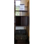 A Ladderex shelving unit comprising one cupboard with sliding doors and metal supports with
