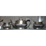 A three piece silver plated tea service, consisting tea pot, sugar bowl and milk jug