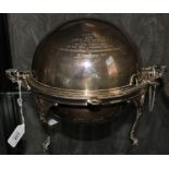 An early 20th century silver plated dome shaped entree dish with inscription relating to the
