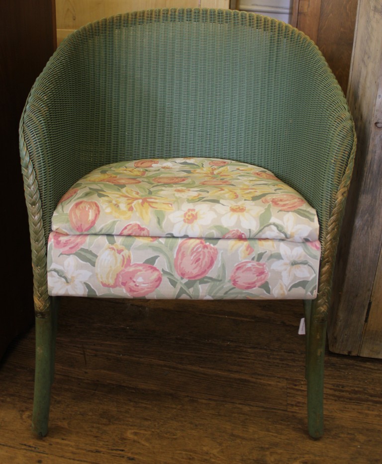 A mid 20th century green-painted Lloyd Loom-style occasional chair with fabric upholstered removable