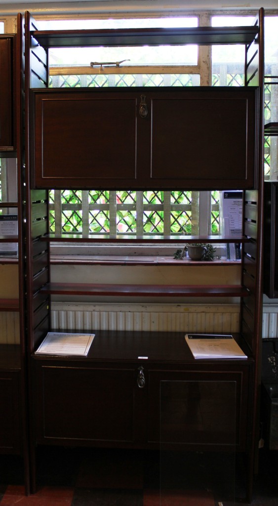 A Ladderax shelving unit, comprising drinks cabinet with adjustable shelves (possibly Ladderax 80